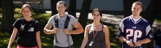 A group of students walking on U N E's Biddeford Campus